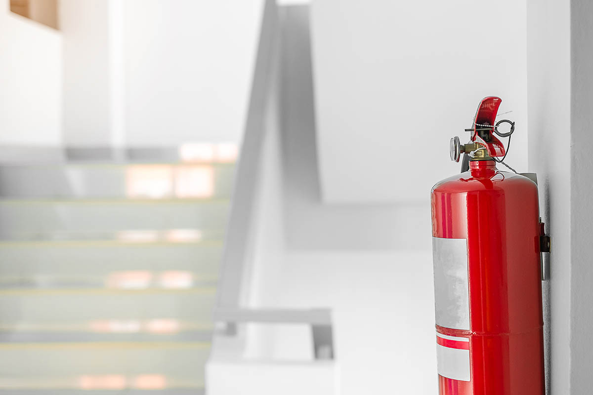 fire extinguisher near staircase in a loft