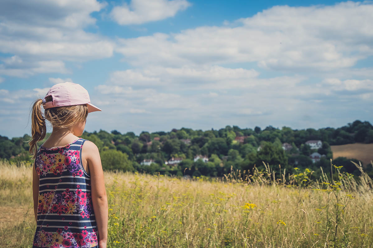 girl looking at surrey county landscape